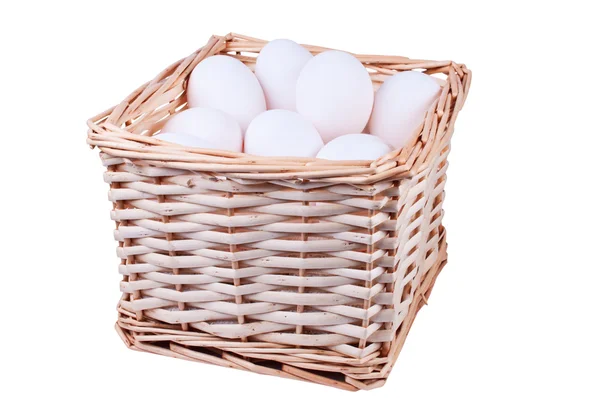 Wicker basket full of chicken eggs — Stock Photo, Image