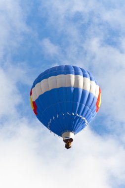 Blue hot balloon up in the blue sky. clipart