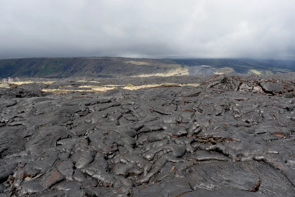 stock image Volcanic lava field on Big island, Hawaii on cloudy day.