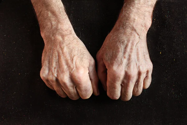 Clenched fists of old man — Stock Photo, Image