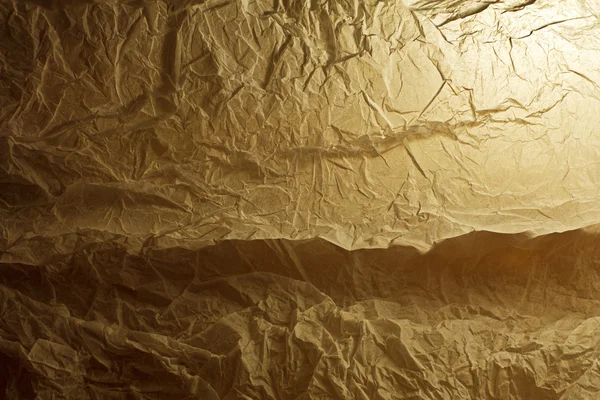 Crumpled paper on a gleam — Stock Photo, Image