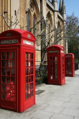 Telephone booths on a London street clipart