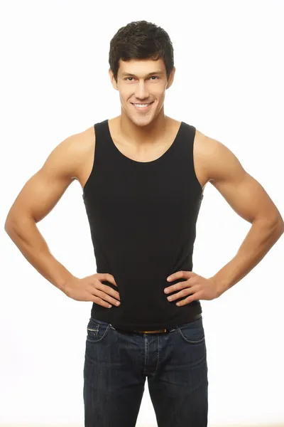 Young caucasian smiling handsome athletic man showing muscle happy — Stock Photo, Image