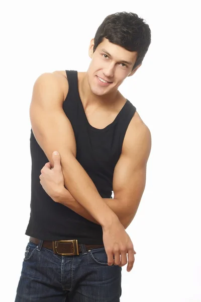 Jovem caucasiano sorrindo bonito atlético homem mostrando músculo — Fotografia de Stock