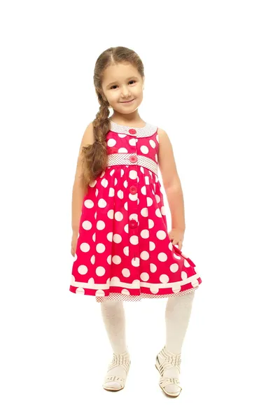 Portret van een vrij klein meisje in roze jurk — Stockfoto