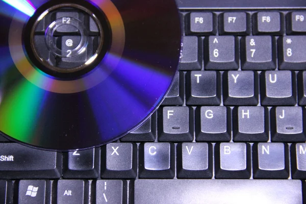 Disc on the keyboard — Stock Photo, Image
