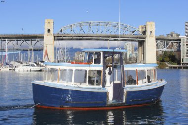 A Passenger Ferry Leaves Dock clipart