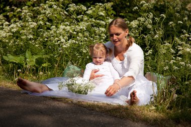 Monther and child in the nature clipart