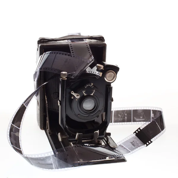 Old camera with negatives — Stock Photo, Image