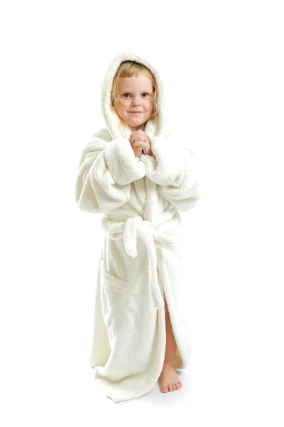 Little cute girl in a bathrobe isolated on a white background Stock Picture