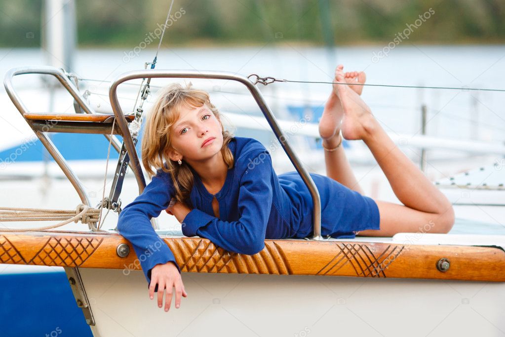 Playful pretty little girl on sail boat — Stock Photo © zagorodnaya ...