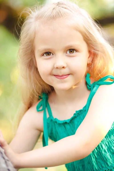 Portrait of a little girl in the summer sarafan — Stock Photo, Image