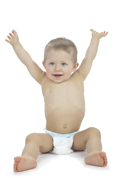 Baby boy sitting with arms raised Stock Photo