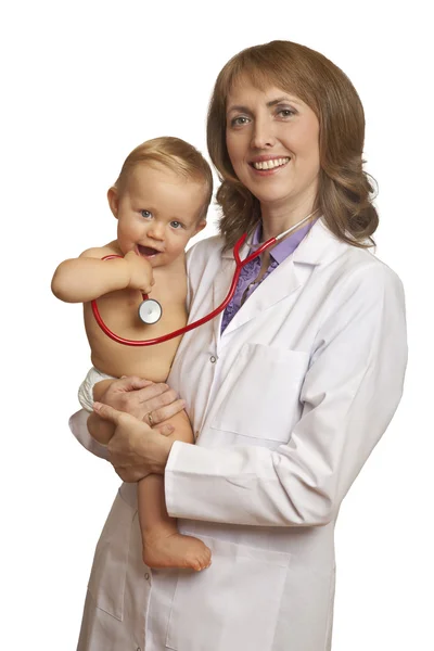 Médico y bebé sonriente con estetoscopio Imagen de stock