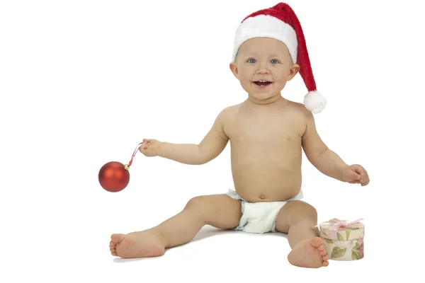 Little Santa with gift box and Christmas bauble — Stock Photo, Image