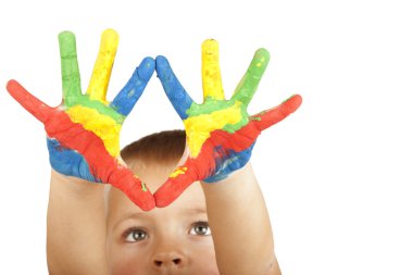 Smiling child with painted hands (focus on hands) clipart