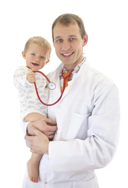 Médico y bebé sonriente con estetoscopio — Foto de Stock