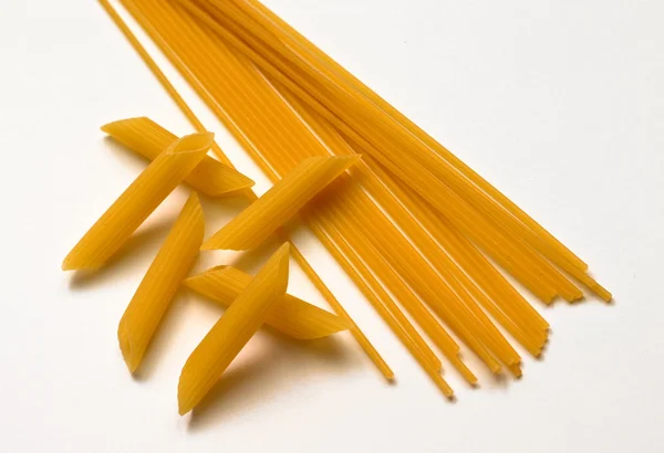 Uncooked pasta selection with raw spaghetti — Stock Photo, Image