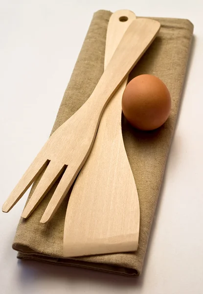 Wooden kitchen utensils set with egg — Stock Photo, Image