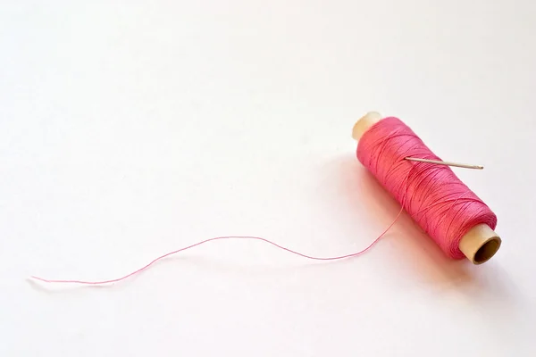 stock image Spool of thread and needle