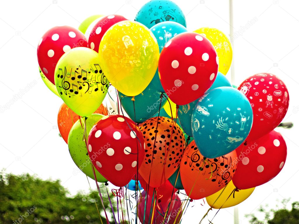A bunch of bright multi-colour balloons