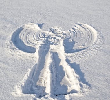Angel in the snow. clipart