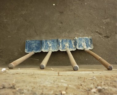 4 dirty shovel, leaning against the earthen wall. top view clipart