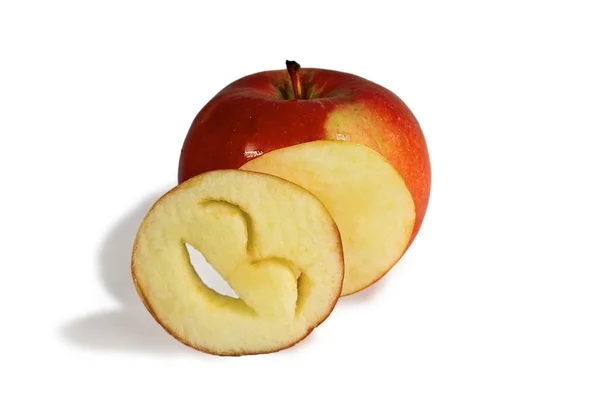 Bright red apple and cut into a laughing smiley face carved from — Stock Photo, Image