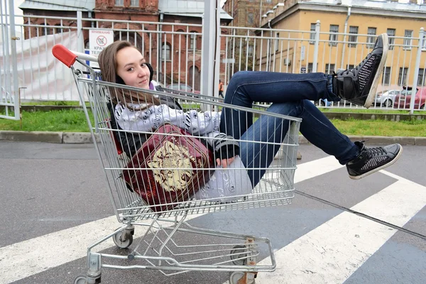 stock image Young girl sitting in a grocery cart