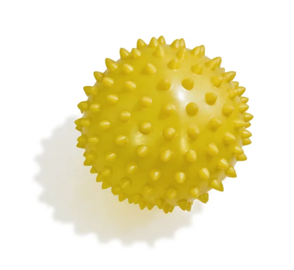 stock image Yellow rubber ball with spikes. Close-up, isolated