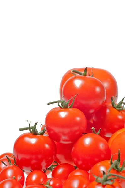 Variety of tomatoes piled up and isolated on white background — Stock Photo, Image