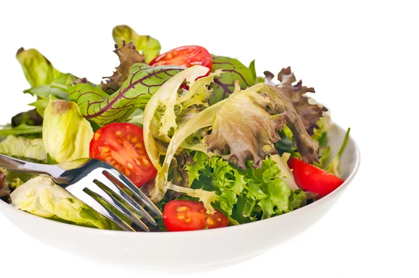 Fresh tomato and lettuce salad with a fork close up — Stock Photo, Image
