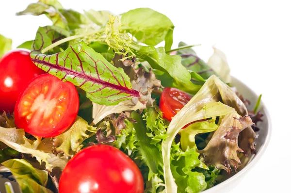 Extreme close up of fresh tomato and lettuce salad — Stock Photo, Image