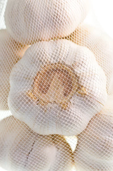 A bag of garlic close up as a background — Stock Photo, Image
