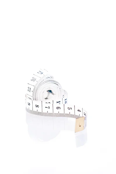 Tape measure roll on white background — Stock Photo, Image