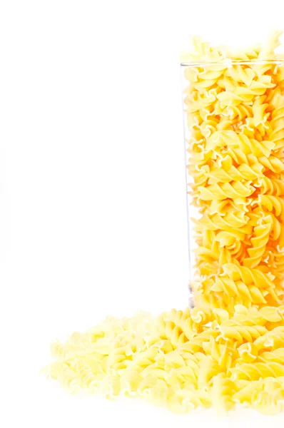Fusilli pasta in a glass container — Stock Photo, Image