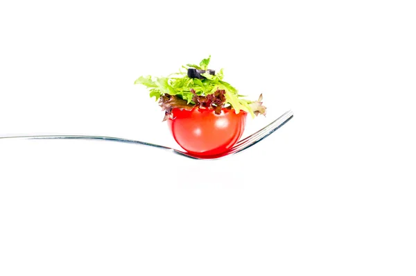Fresh tomato and salad canape on a fork — Stock Photo, Image