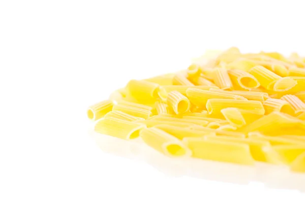 Penne pasta pilled up and close up — Stock Photo, Image