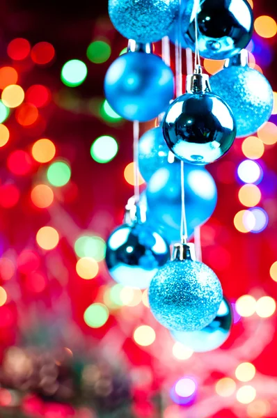 Blue Christmas hanging baubles with lights at the background — Stock Photo, Image