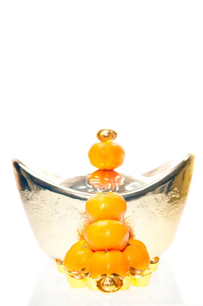 Ingot stacked on tangerine — Stock Photo, Image