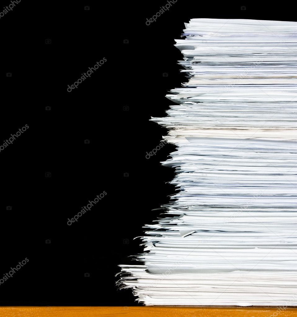Stack of documents or files, overload of paperwork on black background