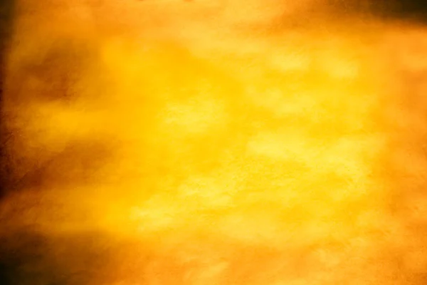 Yellow orange paper parchment fabric texture background vignette — Stock Photo, Image
