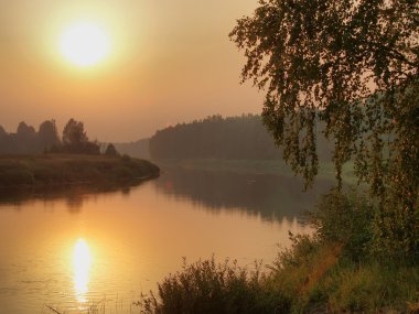 Summer twilight on the river Mologa in Novgorod region. clipart