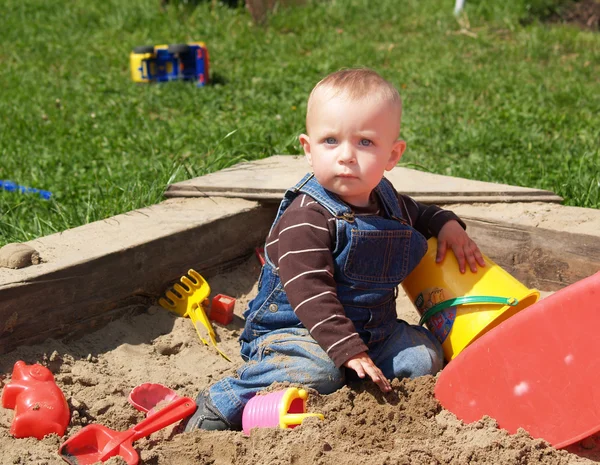 Girl in sand-pit — Stock Photo, Image