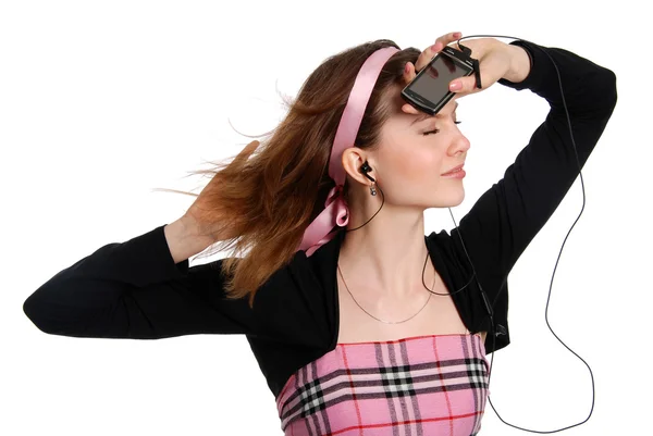 The girl listens to music in ear-phones — Stock Photo, Image