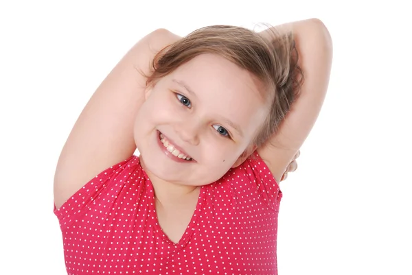 Flickan har kombinerat händer bakom ett huvud och ler — Stockfoto