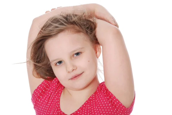 Flickan har kombinerat händer bakom en huvud — Stockfoto