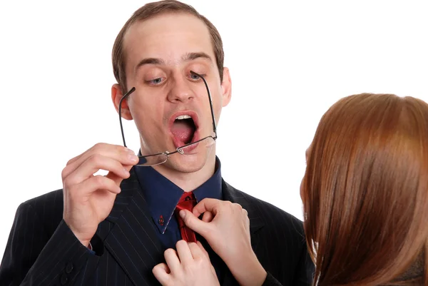 Young woman tries on glasses to the businessman — Stock Photo, Image