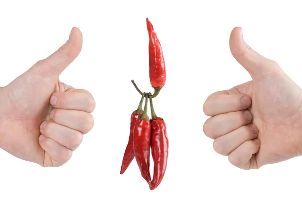 En röd peppar lyfter tre peppar — Stockfoto