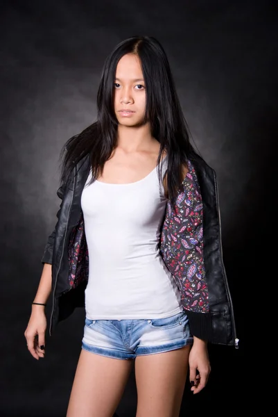 Portrait of Asian girl in a leather jacket — Stock Photo, Image